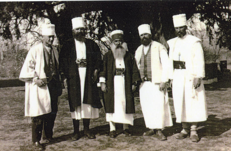 Baba Mehmet Çeno (1882-1934) surrounded by the Bektashi dervishes of the teqe (monastery) of Fushë Kruja, Albania (photo: Dayrell Oakley-Hill, ca. 1934).